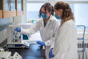 Two students working in a lab